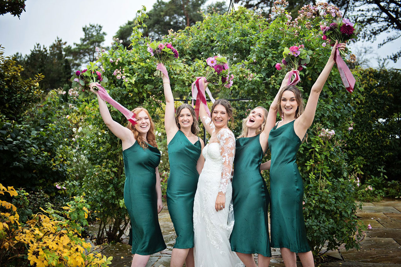 Bride and Bridemaids throwing bouquets
