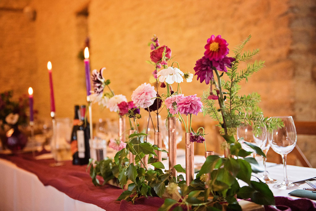 Purple flowers in vases at Wedding meal