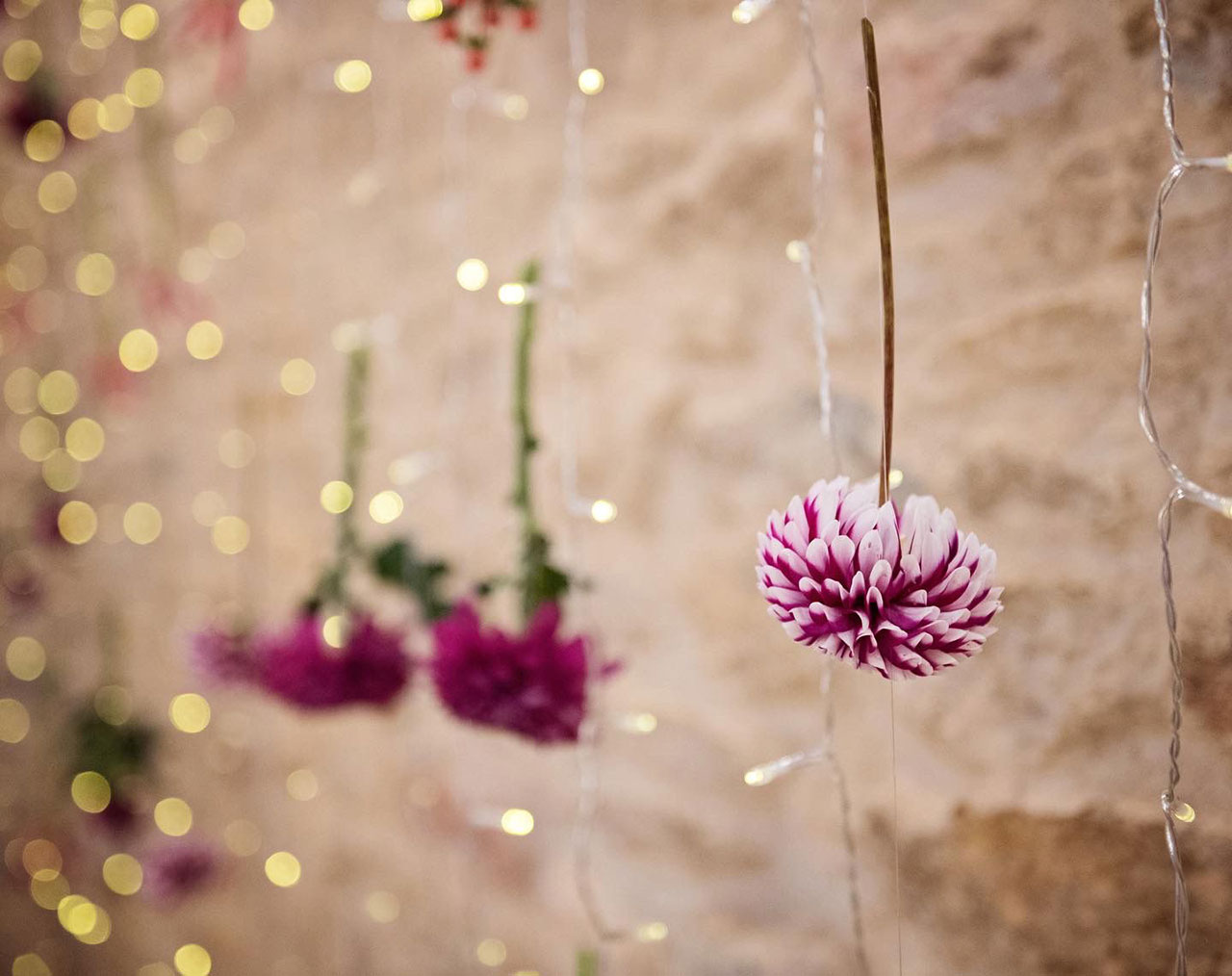 Hanging flowers in barn wedding