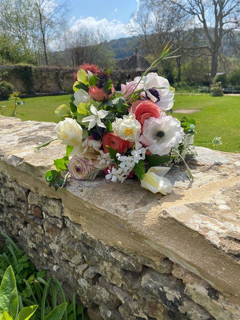 Spring posy on Cotswold wall