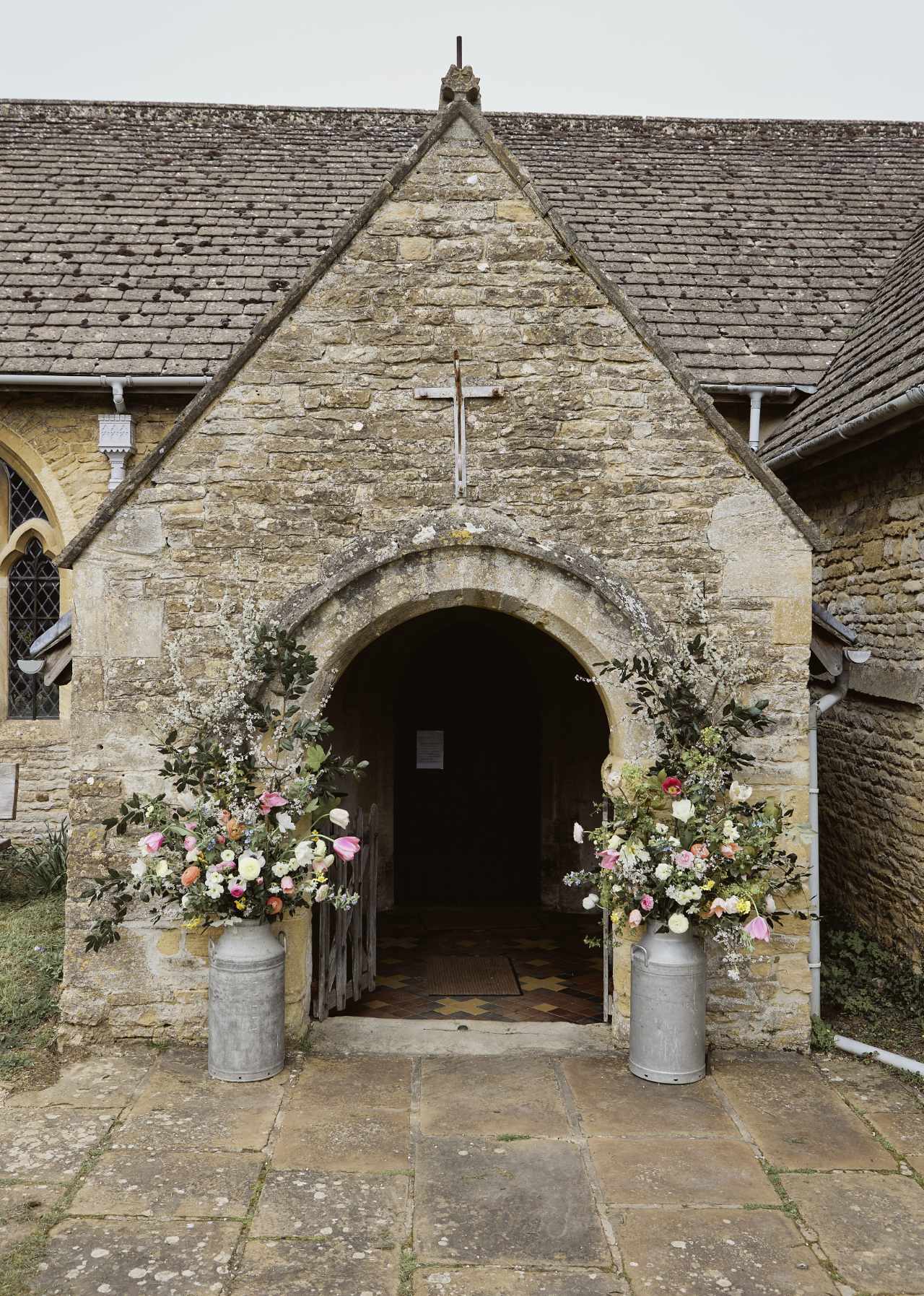 Cotswold church flowers in churns