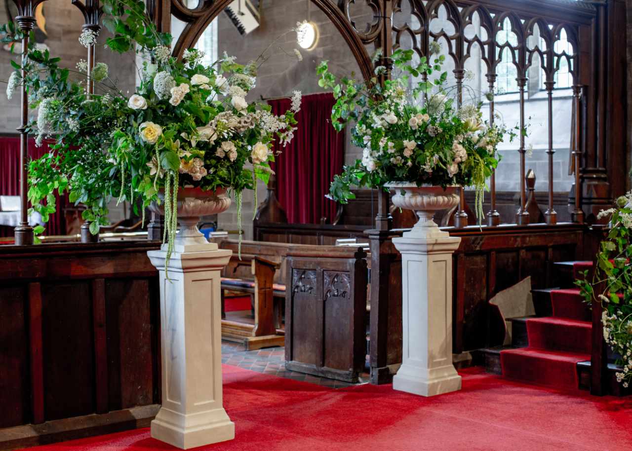 Cradley Church with urns of flowers