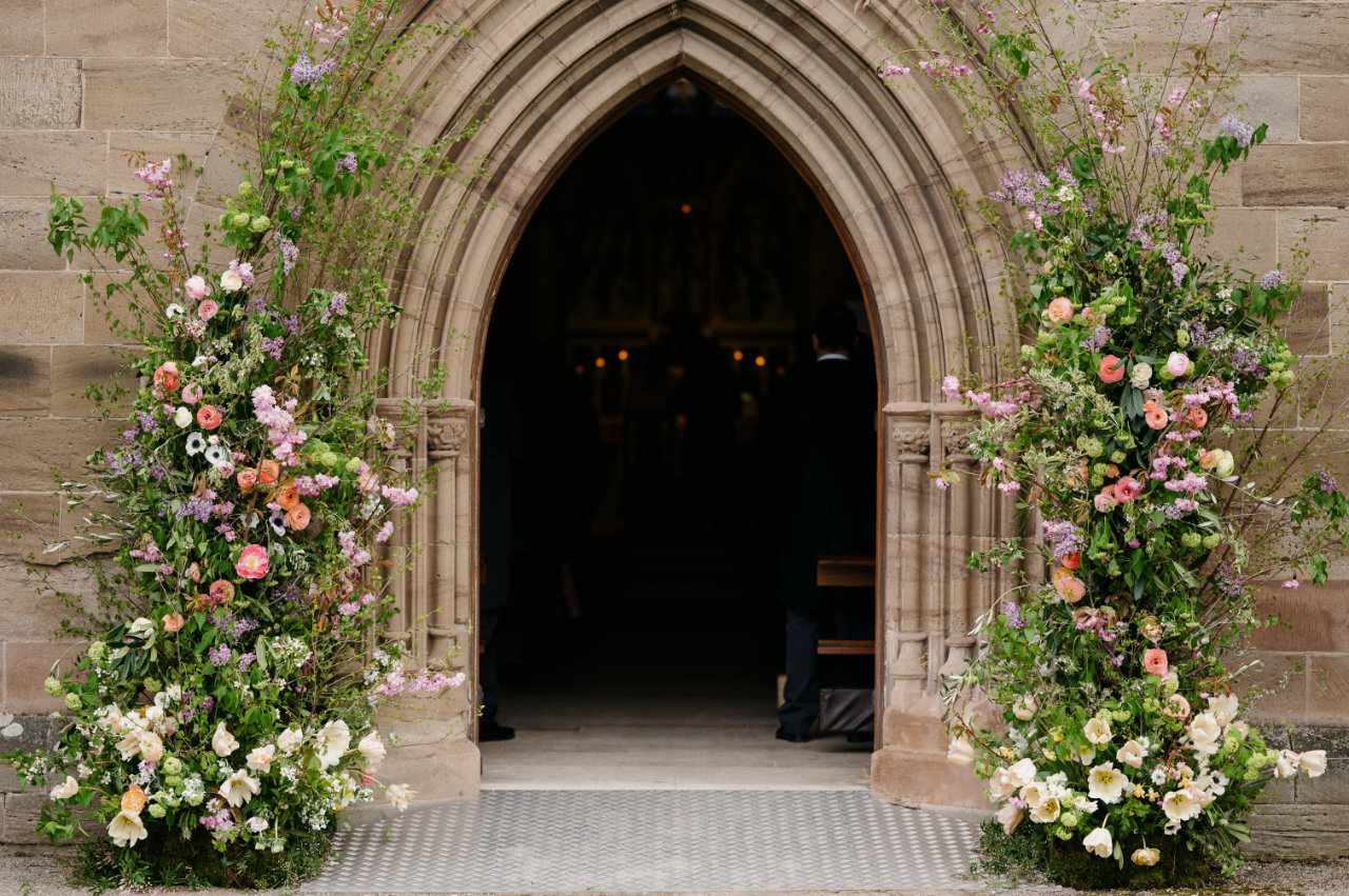 Flowers surrounding church archway