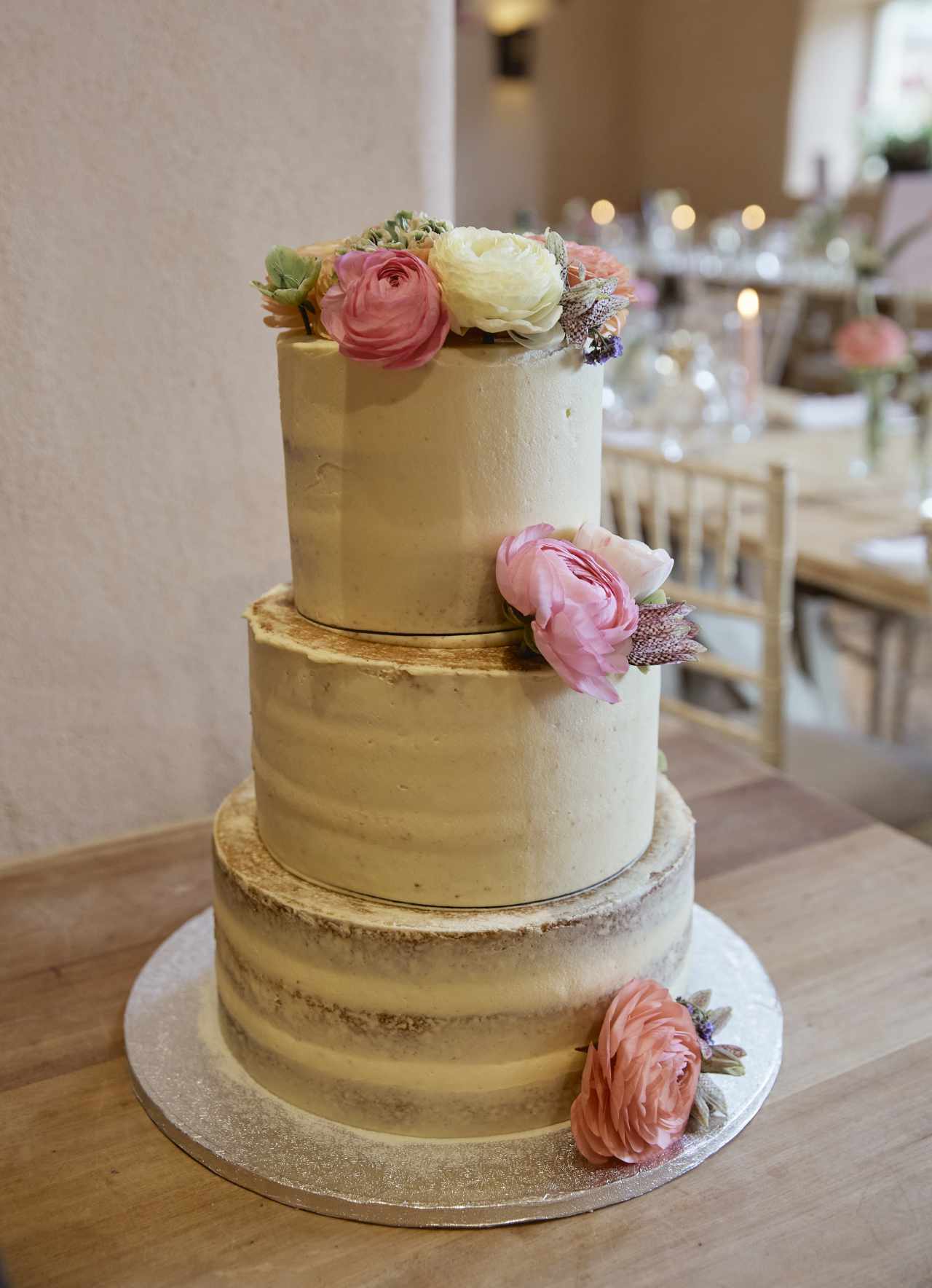 Semi naked wedding cake with beautiful flowers