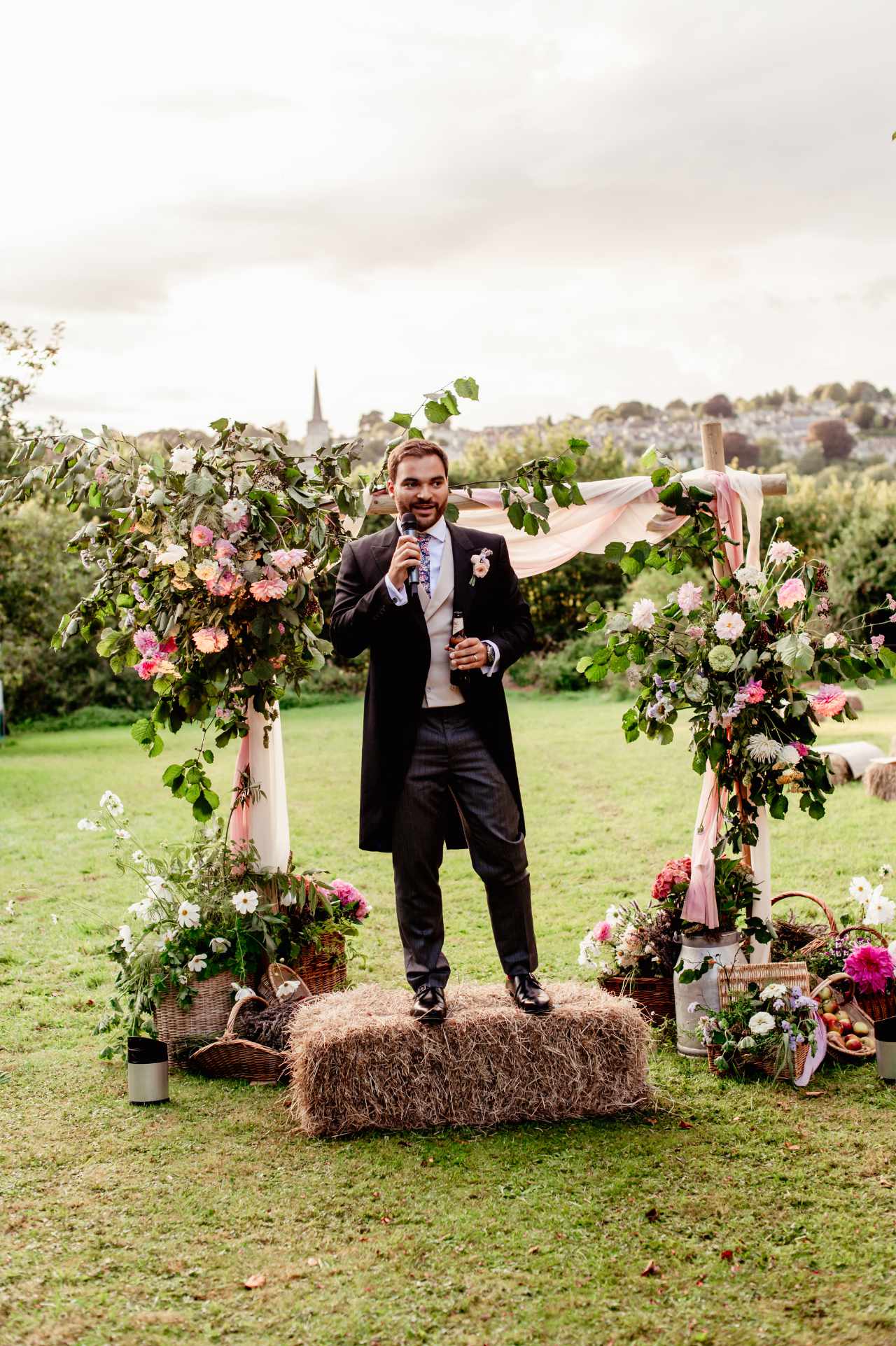 Wedding speech on hay bale with flowers