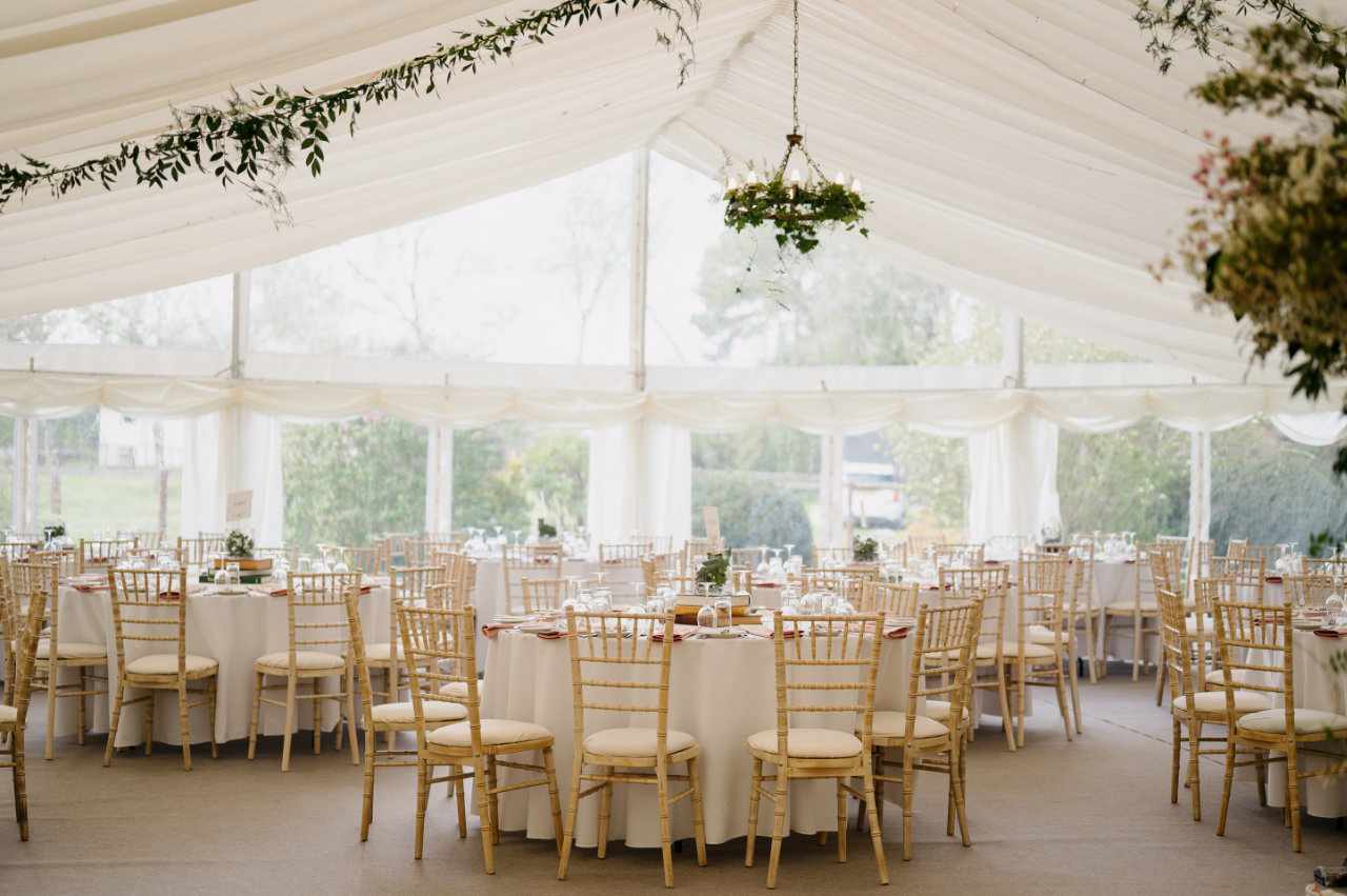Marquee wedding venue with floral decorations